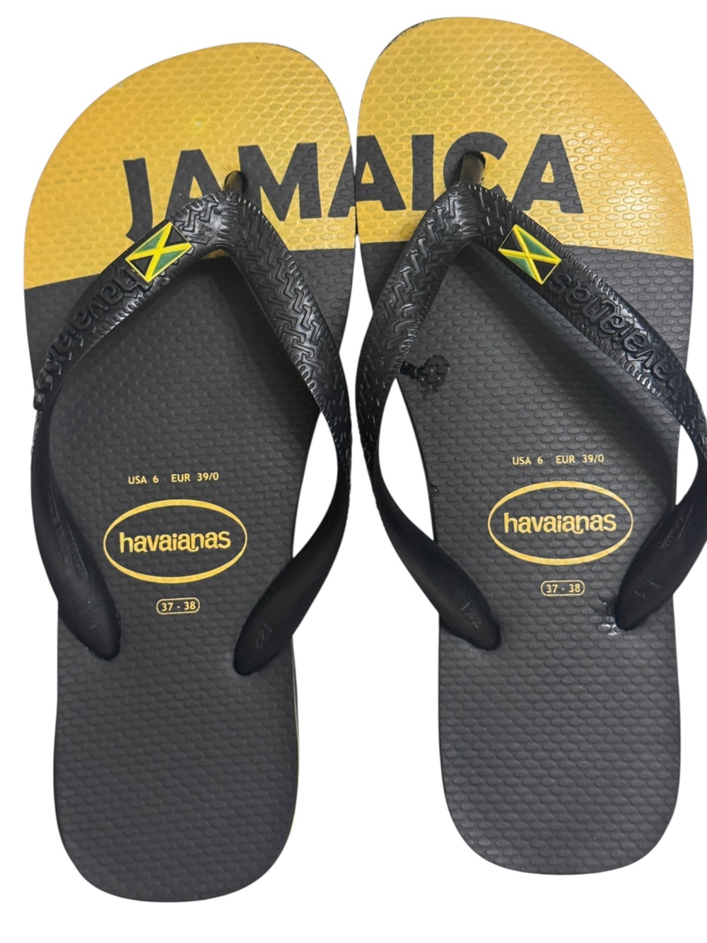 HAVAIANAS Slim Flip Flops in black and yellow Jamaica version